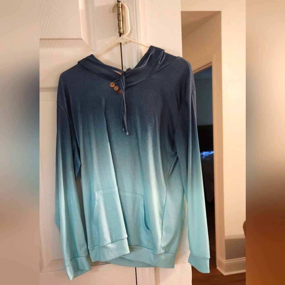 A blue gradient jacket with wood buttons